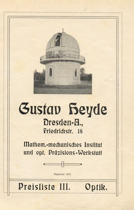 A white building with a dome on it
Description automatically generated