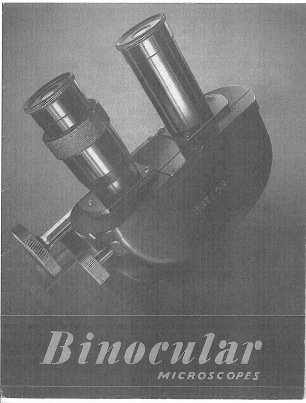 A black and white photo of a microscope
Description automatically generated