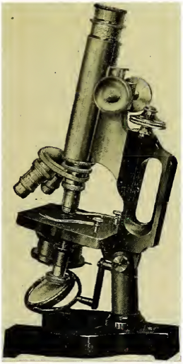 A picture containing old, microscope
Description automatically generated