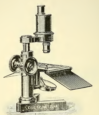 A picture containing microscope
Description automatically generated