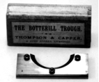 A picture containing text, number, metal, doorplate
Description automatically generated