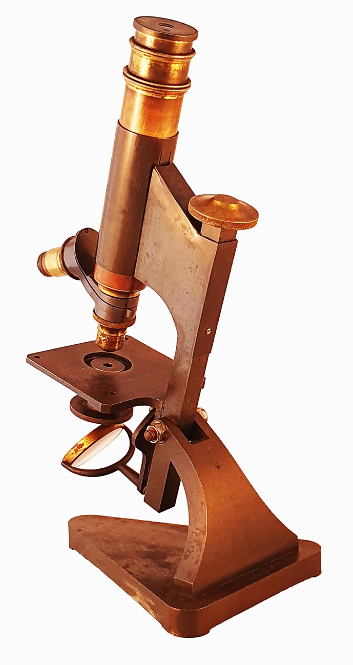 Beck Star Microscope A picture containing table, sitting, wooden, brownDescription ...