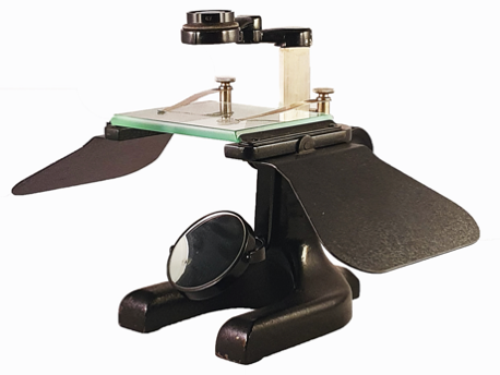 A picture containing sitting, table, desk, person
Description automatically generated